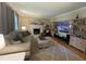 Cozy living room featuring a fireplace, plush seating, and built-in shelving at 321 Willowood Dr, Henderson, NC 27536