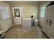 Walk-in pantry space with a refrigerator and access to multiple doors at 321 Willowood Dr, Henderson, NC 27536