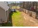 Large backyard with wooden fence, deck and privacy, ideal for outdoor activities and entertaining at 35 Wickersham Way, Louisburg, NC 27549