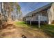 Spacious backyard with a deck, privacy fence, and ample room for outdoor recreation at 35 Wickersham Way, Louisburg, NC 27549