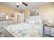 Comfortable bedroom with a decorative bed frame, dresser, and ample natural light for a peaceful retreat at 35 Wickersham Way, Louisburg, NC 27549