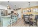 Charming kitchen featuring a breakfast bar with seating and an adjacent dining area with lots of natural light at 35 Wickersham Way, Louisburg, NC 27549