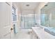 Classic bathroom features tiled walls and a shower-tub combination with glass doors at 3613 Hope Valley Rd, Durham, NC 27707