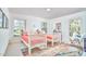 Bright bedroom features two twin beds, colorful decor, and plenty of natural light at 3613 Hope Valley Rd, Durham, NC 27707
