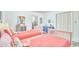 Bright bedroom features two twin beds, colorful decor, and plenty of natural light at 3613 Hope Valley Rd, Durham, NC 27707