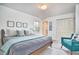 Bright bedroom features neutral walls, a modern bed, and cozy decor, creating a serene and inviting space at 3613 Hope Valley Rd, Durham, NC 27707