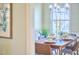 Cozy dining area features a wooden table, modern chandelier, and stylish decor for intimate gatherings at 3613 Hope Valley Rd, Durham, NC 27707