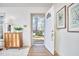 Bright foyer features an open front door with view of the mature trees and meticulous landscaping at 3613 Hope Valley Rd, Durham, NC 27707