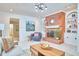 Cozy living room features a brick fireplace, built-in shelves, and comfortable seating at 3613 Hope Valley Rd, Durham, NC 27707