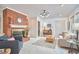Spacious living room with brick fireplace, built-ins, and comfortable seating area at 3613 Hope Valley Rd, Durham, NC 27707