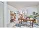 Well-lit office with natural light, desk, shelving, and a view to the outside at 3613 Hope Valley Rd, Durham, NC 27707