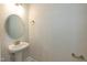 Powder room featuring pedestal sink and neutral decor at 396 Hopewell Branch Ct, Smithfield, NC 27577