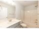 Bright bathroom featuring a single vanity, modern fixtures, and a shower-tub combo, offering functionality and style at 396 Hopewell Branch Ct, Smithfield, NC 27577