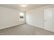 A cozy bedroom with carpet, featuring a single window providing natural light and a peaceful ambiance at 396 Hopewell Branch Ct, Smithfield, NC 27577