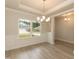 Elegant dining area with large windows, decorative molding, and natural light at 396 Hopewell Branch Ct, Smithfield, NC 27577