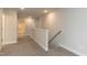 Upstairs hallway featuring plush carpet and neutral decor at 396 Hopewell Branch Ct, Smithfield, NC 27577