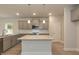 Bright kitchen features granite countertops, stainless appliances, gray cabinets and center island at 396 Hopewell Branch Ct, Smithfield, NC 27577