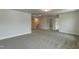 Open, carpeted loft space offers versatile living with neutral walls and natural light from a central skylight at 396 Hopewell Branch Ct, Smithfield, NC 27577