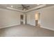 Spacious main bedroom with ceiling fan and tray ceiling at 396 Hopewell Branch Ct, Smithfield, NC 27577