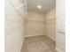 Spacious walk-in closet with plenty of hanging storage at 396 Hopewell Branch Ct, Smithfield, NC 27577