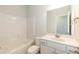 Clean bathroom with a tub-shower combo and a modern vanity with ample storage at 410 Hopewell Branch Ct, Smithfield, NC 27577