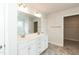 Bathroom vanity featuring double sinks, marble countertops, and white cabinets at 410 Hopewell Branch Ct, Smithfield, NC 27577