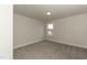Brightly lit bedroom with carpet and a window at 410 Hopewell Branch Ct, Smithfield, NC 27577