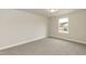 Bedroom with a window providing natural light and carpeted floors at 410 Hopewell Branch Ct, Smithfield, NC 27577