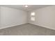 Carpeted bedroom with a window at 410 Hopewell Branch Ct, Smithfield, NC 27577