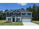 Charming two-story home with a two-car garage, complemented by well-manicured lawn at 410 Hopewell Branch Ct, Smithfield, NC 27577