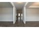 View of a hallway showcases an open floor plan with hardwood floors and bright lighting at 410 Hopewell Branch Ct, Smithfield, NC 27577
