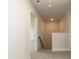 Hallway with carpeted floors and a view of the staircase at 410 Hopewell Branch Ct, Smithfield, NC 27577