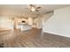 Open-concept living area boasts hardwood floors and flows into a modern kitchen at 410 Hopewell Branch Ct, Smithfield, NC 27577