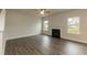 Spacious living room with a cozy fireplace and plenty of natural light at 410 Hopewell Branch Ct, Smithfield, NC 27577