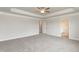 Spacious main bedroom with light gray carpet and a view into the ensuite bathroom at 410 Hopewell Branch Ct, Smithfield, NC 27577