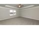 Spacious bedroom featuring a ceiling fan and large window at 410 Hopewell Branch Ct, Smithfield, NC 27577