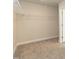 Spacious walk-in closet featuring carpeted floors and wire shelving at 410 Hopewell Branch Ct, Smithfield, NC 27577