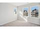 Bedroom filled with natural light from the windows showing outside buildings at 4511 Mint Leaf Ln, Raleigh, NC 27612