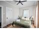 Comfortable bedroom featuring a ceiling fan, neutral walls and warm natural light at 508 S Swain St, Raleigh, NC 27601