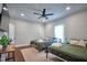 Spacious bedroom with two beds, a ceiling fan, and a mounted television at 508 S Swain St, Raleigh, NC 27601