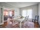 Inviting dining room with hardwood floors, a white dining table and a view to the living room at 508 S Swain St, Raleigh, NC 27601