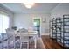 Dining area with hardwood floors, white table, and view into the kitchen at 508 S Swain St, Raleigh, NC 27601