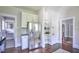 Charming kitchen featuring stainless steel refrigerator and convenient open shelving at 508 S Swain St, Raleigh, NC 27601