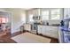 Bright kitchen with stainless steel appliances, ample counter space, and hardwood floors at 508 S Swain St, Raleigh, NC 27601