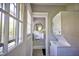 Laundry area with stackable washer and dryer and adjacent powder room at 508 S Swain St, Raleigh, NC 27601