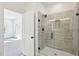 Bathroom featuring a tile shower with a frameless glass door and matte black hardware at 556 Contempo Dr # 22, Rolesville, NC 27571