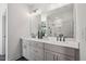 Elegant bathroom features a double vanity, large mirror, and sleek matte black fixtures at 556 Contempo Dr # 22, Rolesville, NC 27571