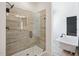 Bathroom showcasing a tiled shower with frameless glass doors and a soaking tub at 556 Contempo Dr # 22, Rolesville, NC 27571