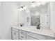 Modern bathroom featuring double sinks, sleek fixtures, quartz countertop and a large framed mirror at 556 Contempo Dr # 22, Rolesville, NC 27571