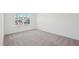 Neutral bedroom showcasing a window view of the neighborhood at 556 Contempo Dr # 22, Rolesville, NC 27571